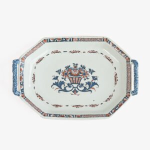 Rouen Faience Tray, an octagonal French banette from c. 1730 with two handles, a painted flower basket, and a red and blue galon rouennais border.