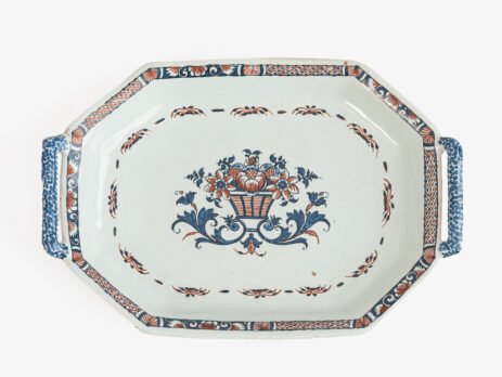 Rouen Faience Tray, an octagonal French banette from c. 1730 with two handles, a painted flower basket, and a red and blue galon rouennais border.