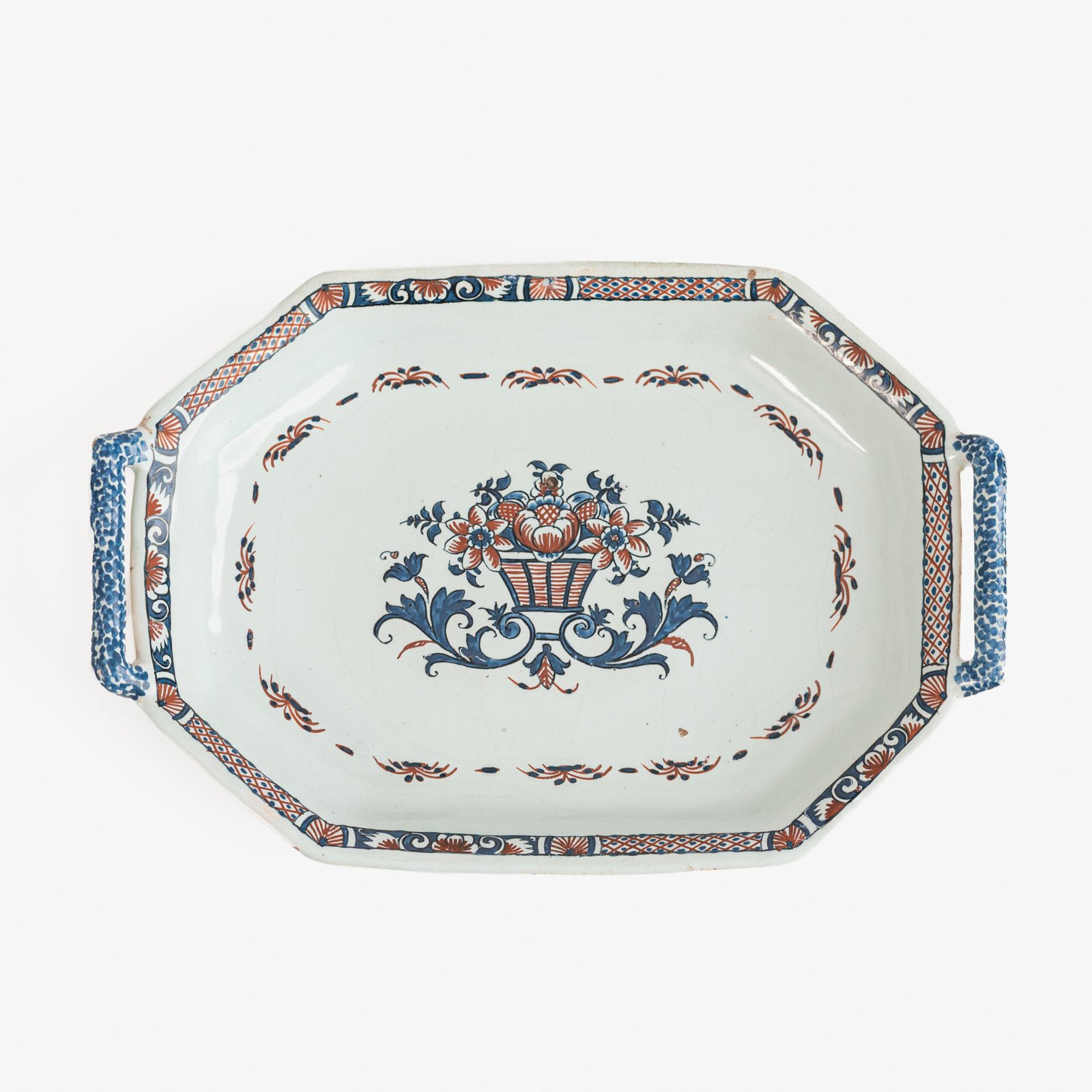 FOTOLATENT-B2309001-hd Rouen Faience Tray, an octagonal French banette from c. 1730 with two handles, a painted flower basket, and a red and blue galon rouennais border.