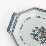 Rouen Faience Tray, an octagonal French banette from c. 1730 with two handles, a painted flower basket, and a red and blue galon rouennais border.