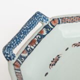 Rouen Faience Tray, an octagonal French banette from c. 1730 with two handles, a painted flower basket, and a red and blue galon rouennais border.