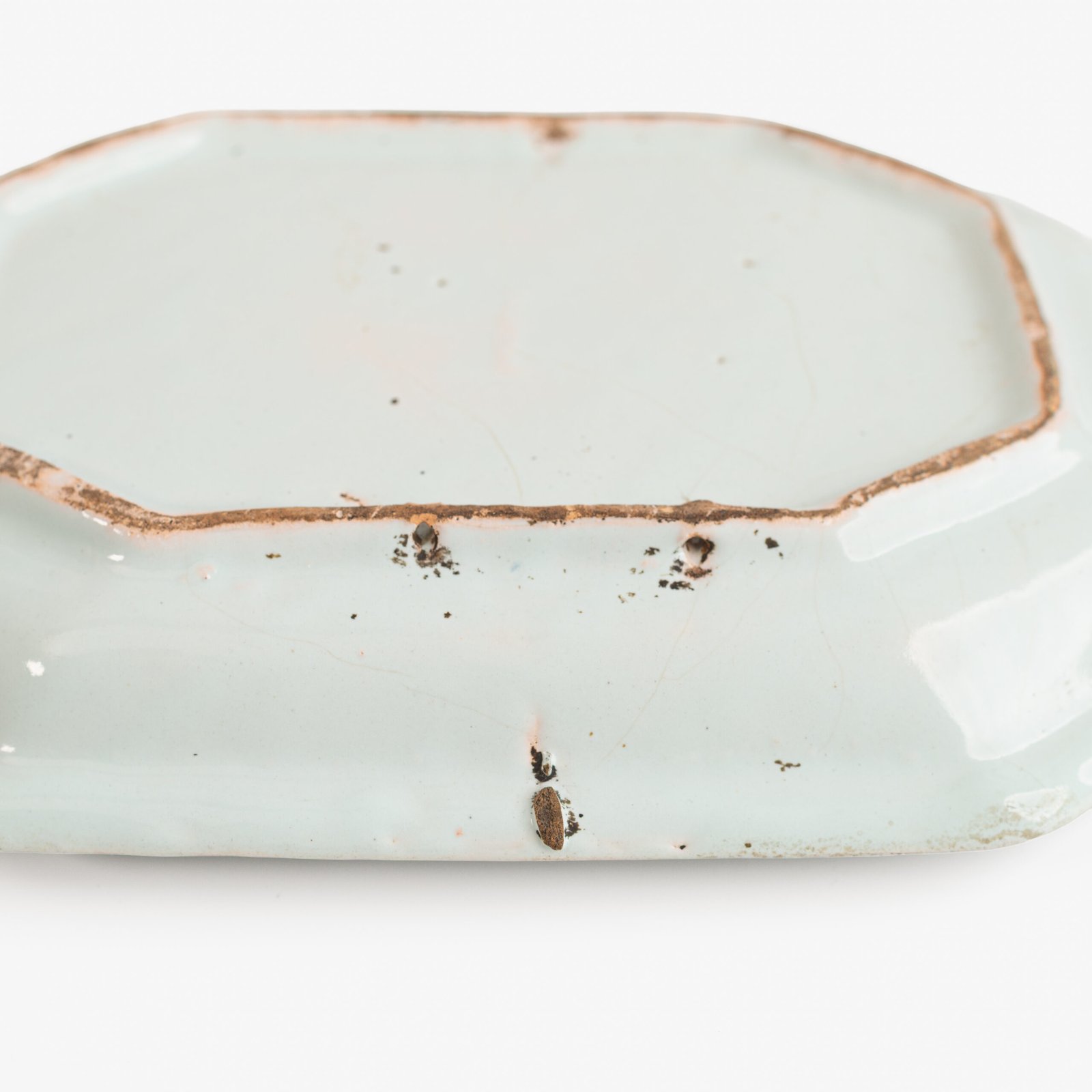 Rouen Faience Tray, an octagonal French banette from c. 1730 with two handles, a painted flower basket, and a red and blue galon rouennais border.