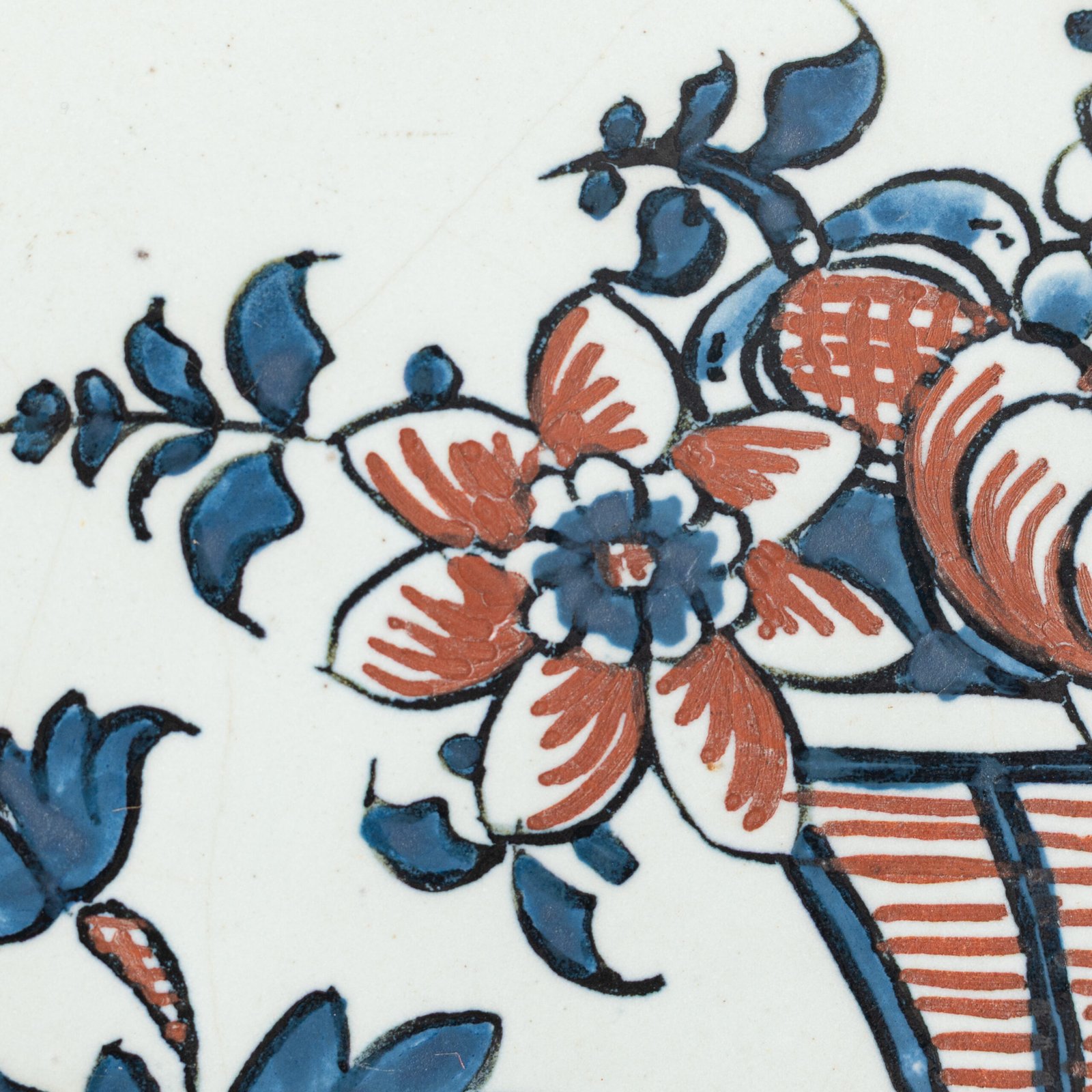 Rouen Faience Tray, an octagonal French banette from c. 1730 with two handles, a painted flower basket, and a red and blue galon rouennais border.