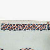 Rouen Faience Tray, an octagonal French banette from c. 1730 with two handles, a painted flower basket, and a red and blue galon rouennais border.