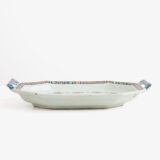 Rouen Faience Tray, an octagonal French banette from c. 1730 with two handles, a painted flower basket, and a red and blue galon rouennais border.