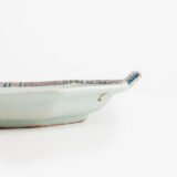 Rouen Faience Tray, an octagonal French banette from c. 1730 with two handles, a painted flower basket, and a red and blue galon rouennais border.