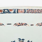 Rouen Faience Tray, an octagonal French banette from c. 1730 with two handles, a painted flower basket, and a red and blue galon rouennais border.