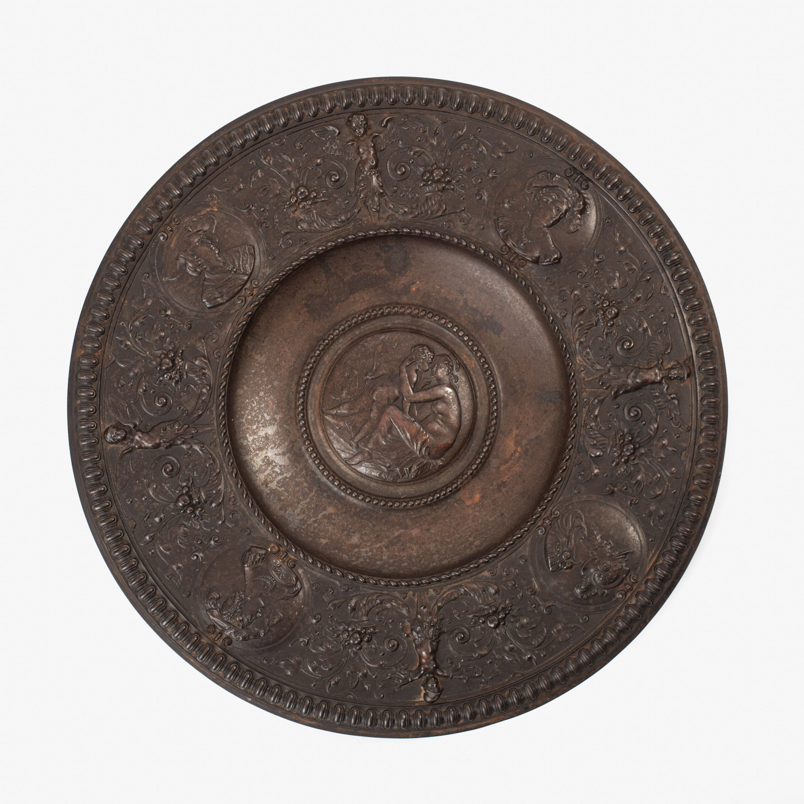 FOTOLATENT-211026-001-hd Lauchhammer Cast Iron Charger, Germany, circa 1870–1900, with Renaissance Revival reliefs, a central scene of Venus and Cupid, portrait medallions and scrolling foliage.