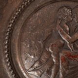 Lauchhammer Cast Iron Charger, Germany, circa 1870–1900, with Renaissance Revival reliefs, a central scene of Venus and Cupid, portrait medallions and scrolling foliage.