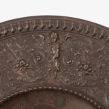 Lauchhammer Cast Iron Charger, Germany, circa 1870–1900, with Renaissance Revival reliefs, a central scene of Venus and Cupid, portrait medallions and scrolling foliage.