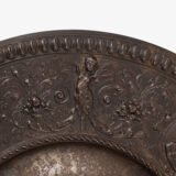 Lauchhammer Cast Iron Charger, Germany, circa 1870–1900, with Renaissance Revival reliefs, a central scene of Venus and Cupid, portrait medallions and scrolling foliage.