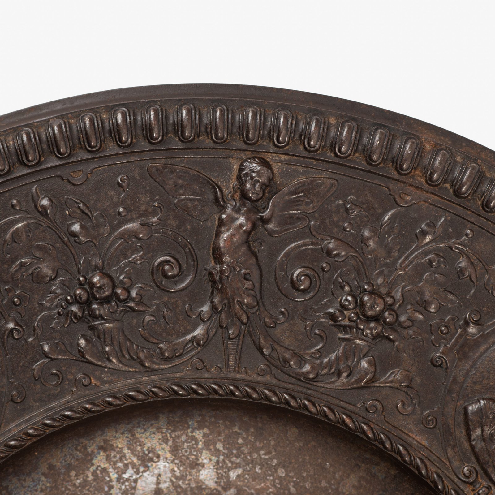 Lauchhammer Cast Iron Charger, Germany, circa 1870–1900, with Renaissance Revival reliefs, a central scene of Venus and Cupid, portrait medallions and scrolling foliage.