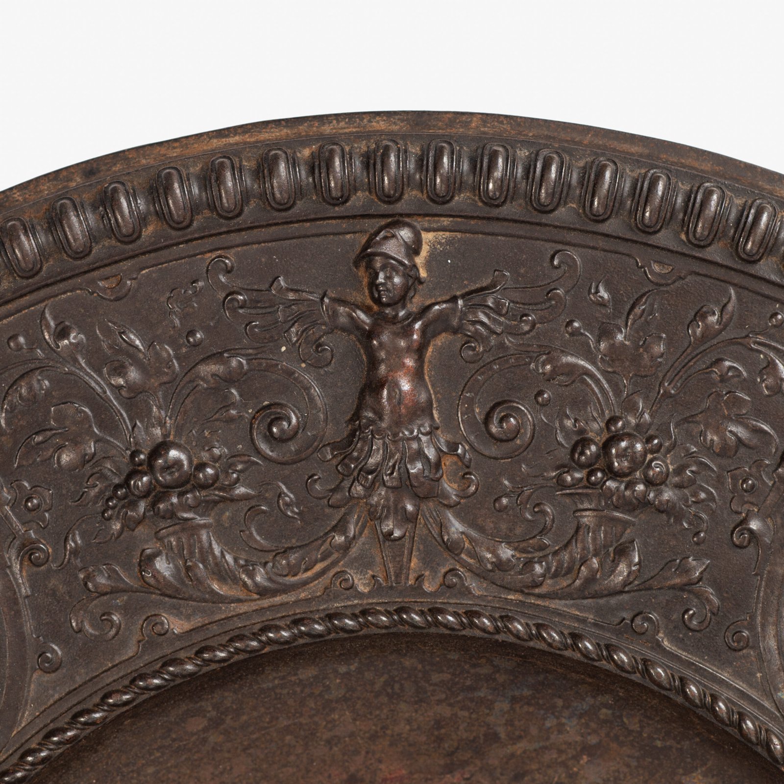 Lauchhammer Cast Iron Charger, Germany, circa 1870–1900, with Renaissance Revival reliefs, a central scene of Venus and Cupid, portrait medallions and scrolling foliage.