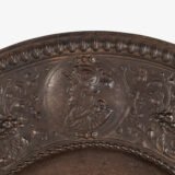 Lauchhammer Cast Iron Charger, Germany, circa 1870–1900, with Renaissance Revival reliefs, a central scene of Venus and Cupid, portrait medallions and scrolling foliage.