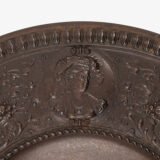 Lauchhammer Cast Iron Charger, Germany, circa 1870–1900, with Renaissance Revival reliefs, a central scene of Venus and Cupid, portrait medallions and scrolling foliage.