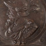 Lauchhammer Cast Iron Charger, Germany, circa 1870–1900, with Renaissance Revival reliefs, a central scene of Venus and Cupid, portrait medallions and scrolling foliage.