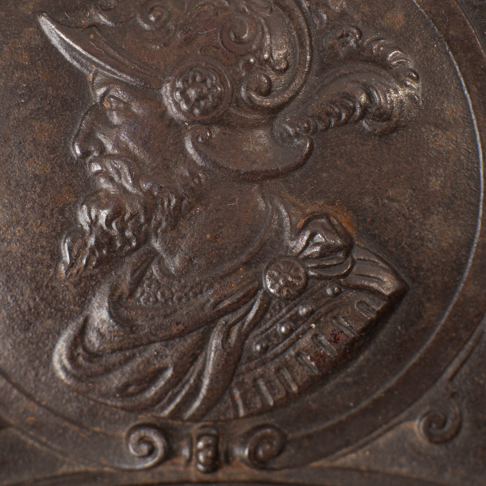 Lauchhammer Cast Iron Charger, Germany, circa 1870–1900, with Renaissance Revival reliefs, a central scene of Venus and Cupid, portrait medallions and scrolling foliage.