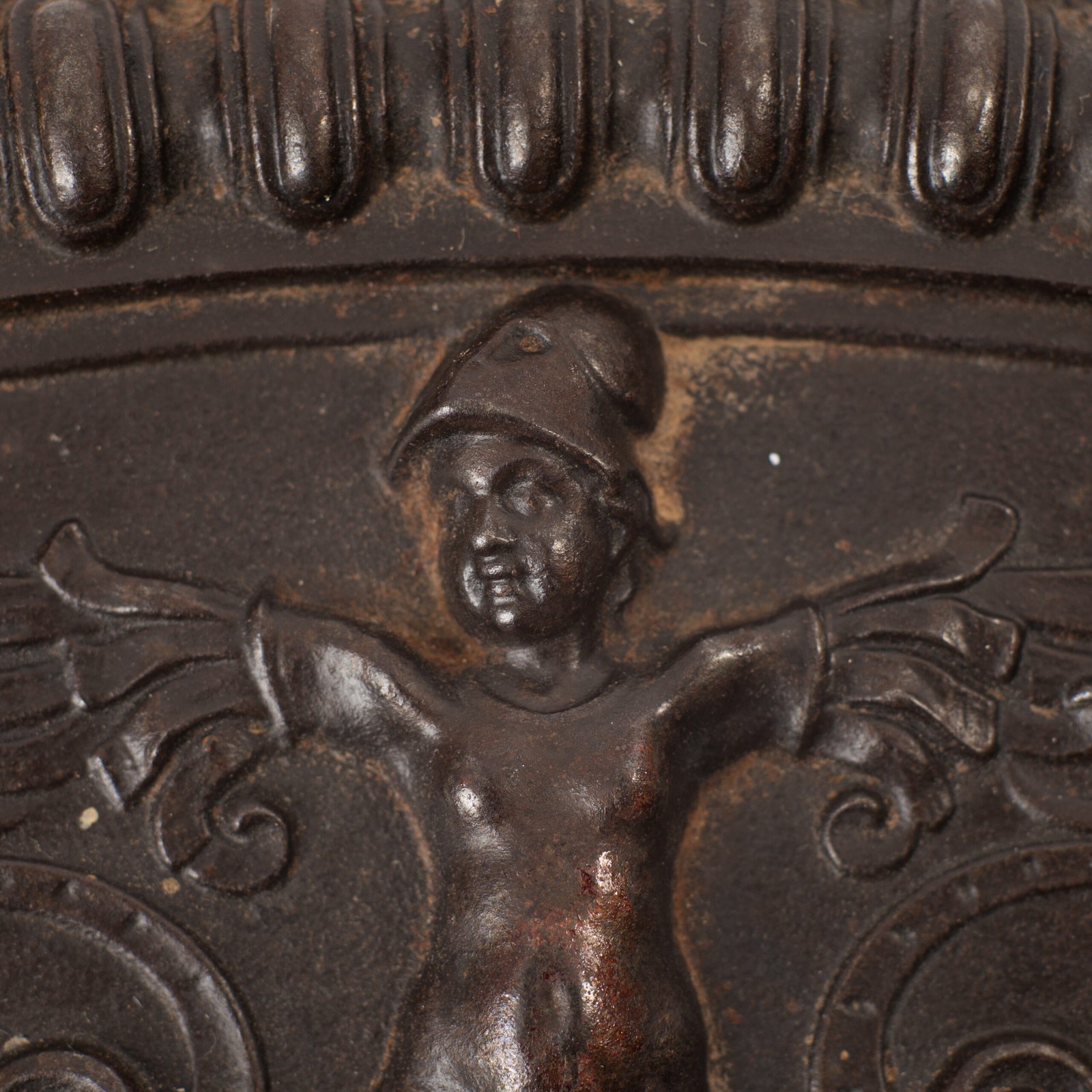 Lauchhammer Cast Iron Charger, Germany, circa 1870–1900, with Renaissance Revival reliefs, a central scene of Venus and Cupid, portrait medallions and scrolling foliage.