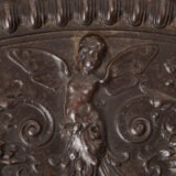 Lauchhammer Cast Iron Charger, Germany, circa 1870–1900, with Renaissance Revival reliefs, a central scene of Venus and Cupid, portrait medallions and scrolling foliage.