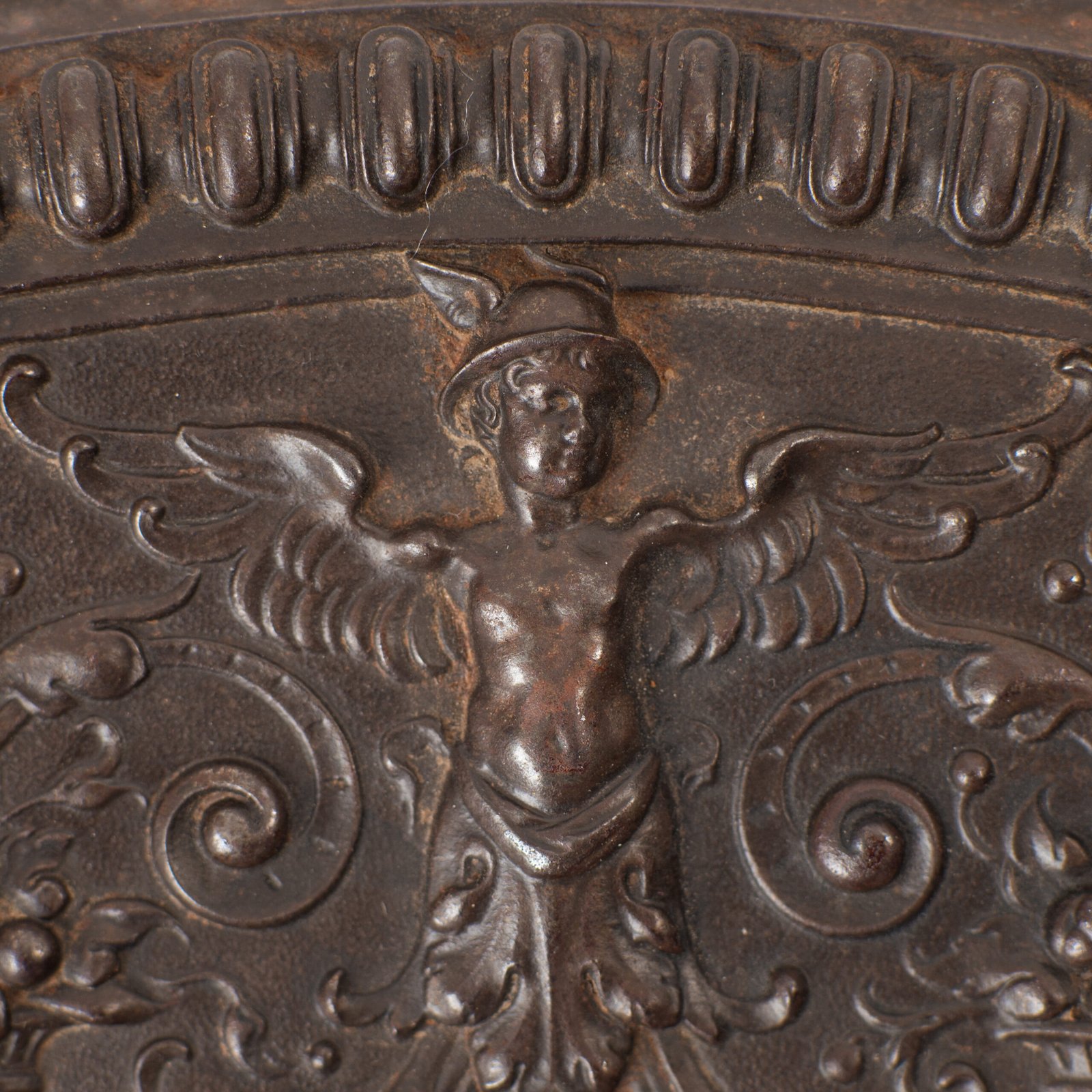 Lauchhammer Cast Iron Charger, Germany, circa 1870–1900, with Renaissance Revival reliefs, a central scene of Venus and Cupid, portrait medallions and scrolling foliage.