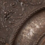 Lauchhammer Cast Iron Charger, Germany, circa 1870–1900, with Renaissance Revival reliefs, a central scene of Venus and Cupid, portrait medallions and scrolling foliage.