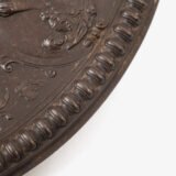 Lauchhammer Cast Iron Charger, Germany, circa 1870–1900, with Renaissance Revival reliefs, a central scene of Venus and Cupid, portrait medallions and scrolling foliage.
