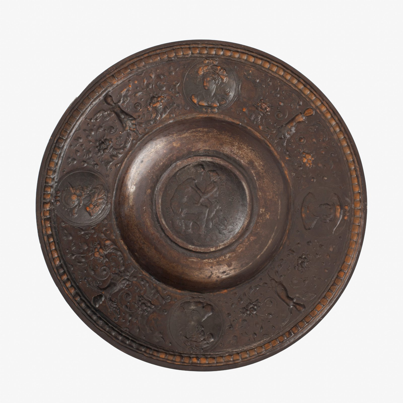 Lauchhammer Cast Iron Charger, Germany, circa 1870–1900, with Renaissance Revival reliefs, a central scene of Venus and Cupid, portrait medallions and scrolling foliage.