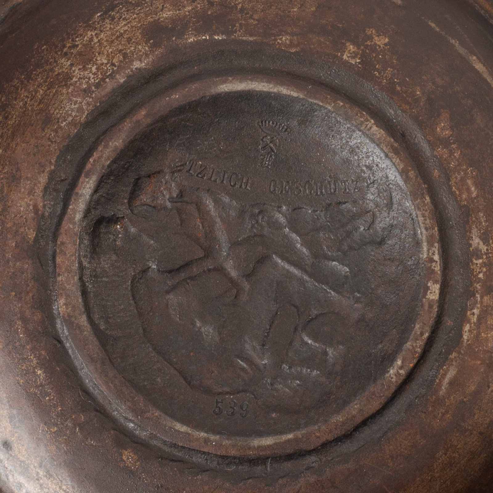 Lauchhammer Cast Iron Charger, Germany, circa 1870–1900, with Renaissance Revival reliefs, a central scene of Venus and Cupid, portrait medallions and scrolling foliage.