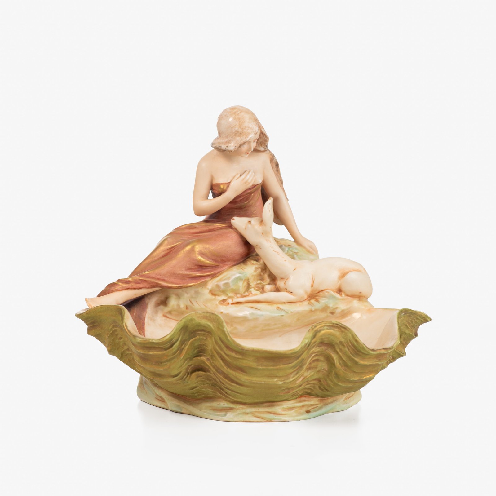 Royal Dux Art Nouveau porcelain centerpiece with a seated maiden and fawn beside a green shell-shaped bowl, hand-painted with gilt highlights, circa 1920–1930.