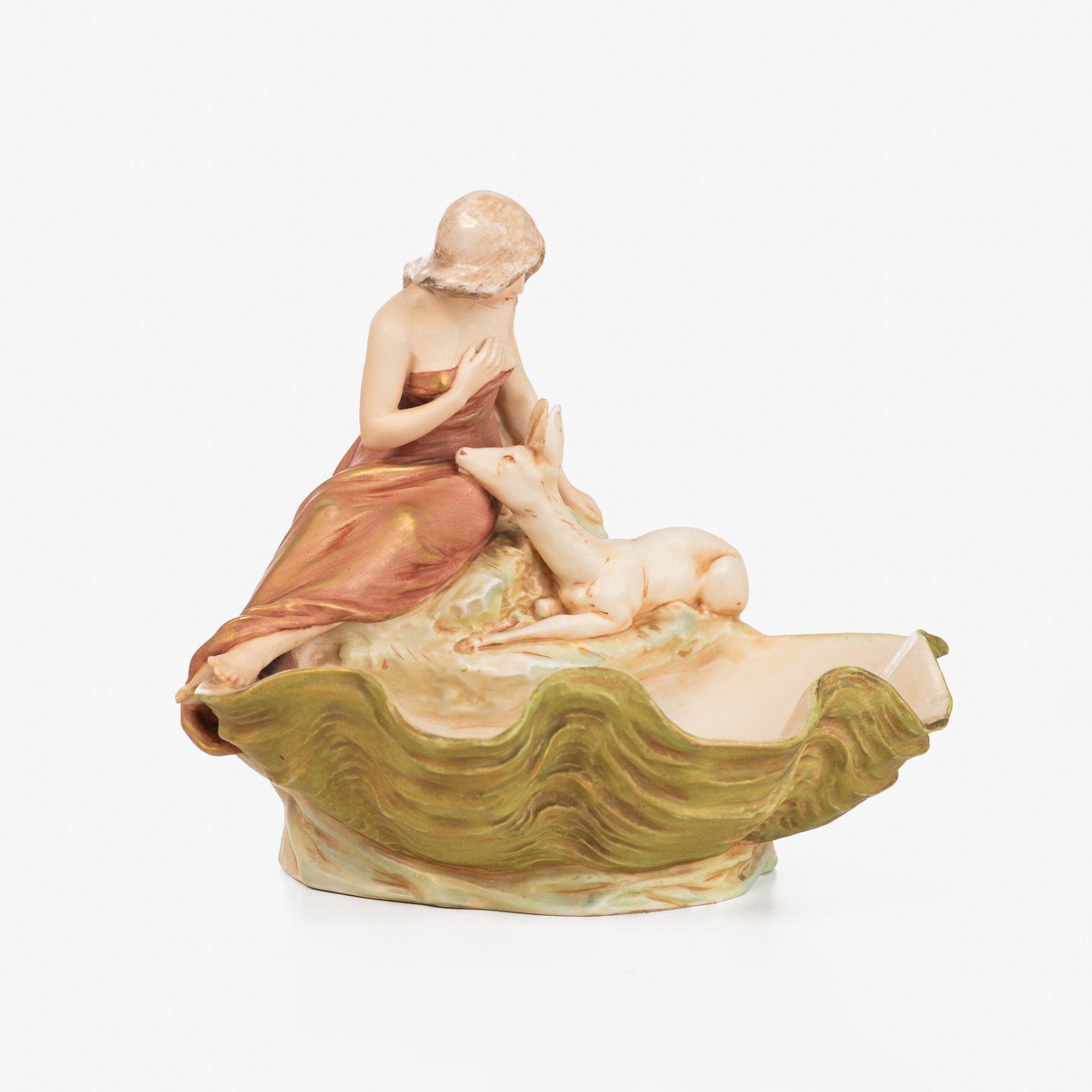 Royal Dux Art Nouveau porcelain centerpiece with a seated maiden and fawn beside a green shell-shaped bowl, hand-painted with gilt highlights, circa 1920–1930.