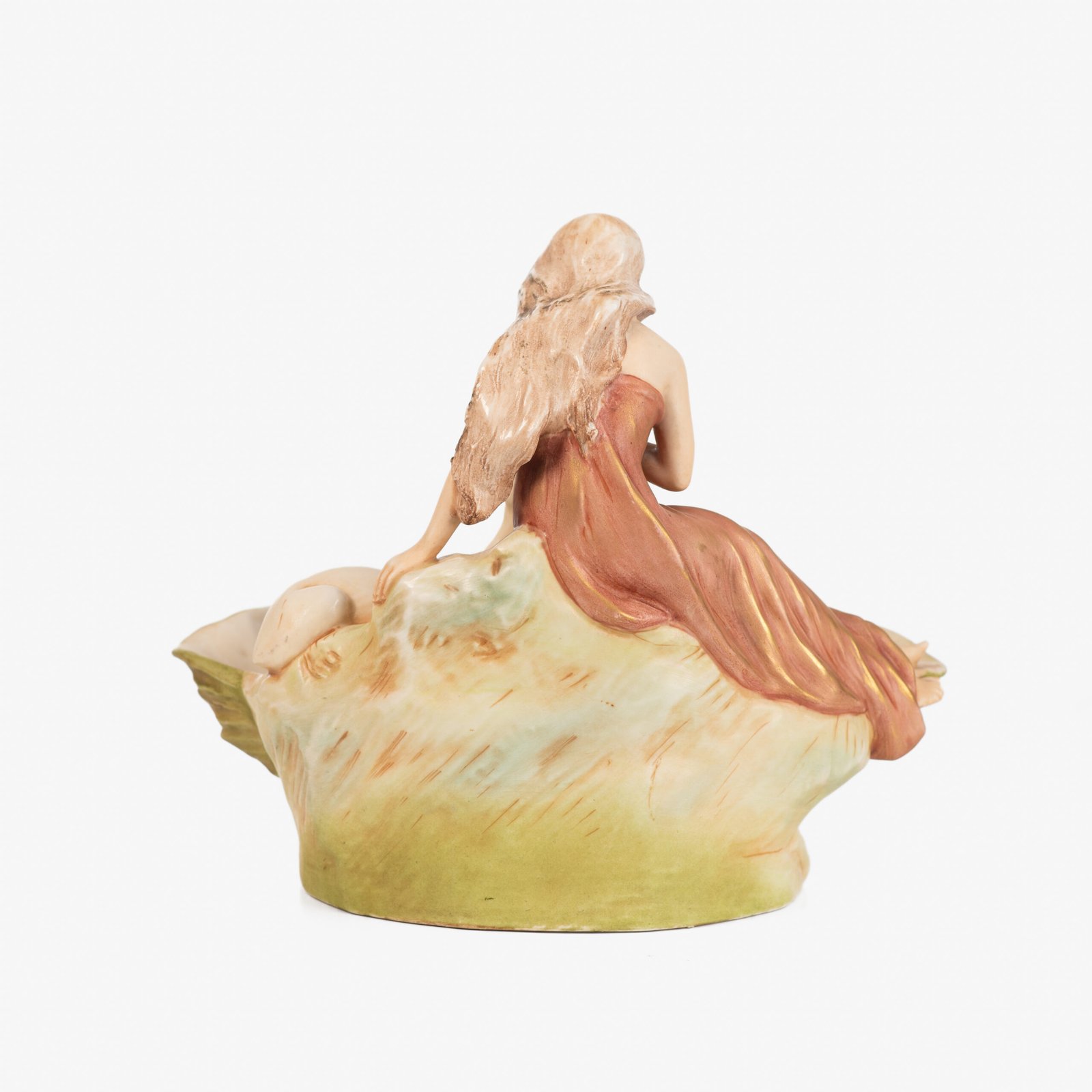 Royal Dux Art Nouveau porcelain centerpiece with a seated maiden and fawn beside a green shell-shaped bowl, hand-painted with gilt highlights, circa 1920–1930.