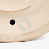 Royal Dux Art Nouveau porcelain centerpiece with a seated maiden and fawn beside a green shell-shaped bowl, hand-painted with gilt highlights, circa 1920–1930.
