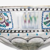 Bohemian Glass Compote, c. 1915, with hand-enamelled birds in scalloped blue panels, geometric glass cutting, gilt rim and a faceted foot decorated with black scrolls and blue leaves.