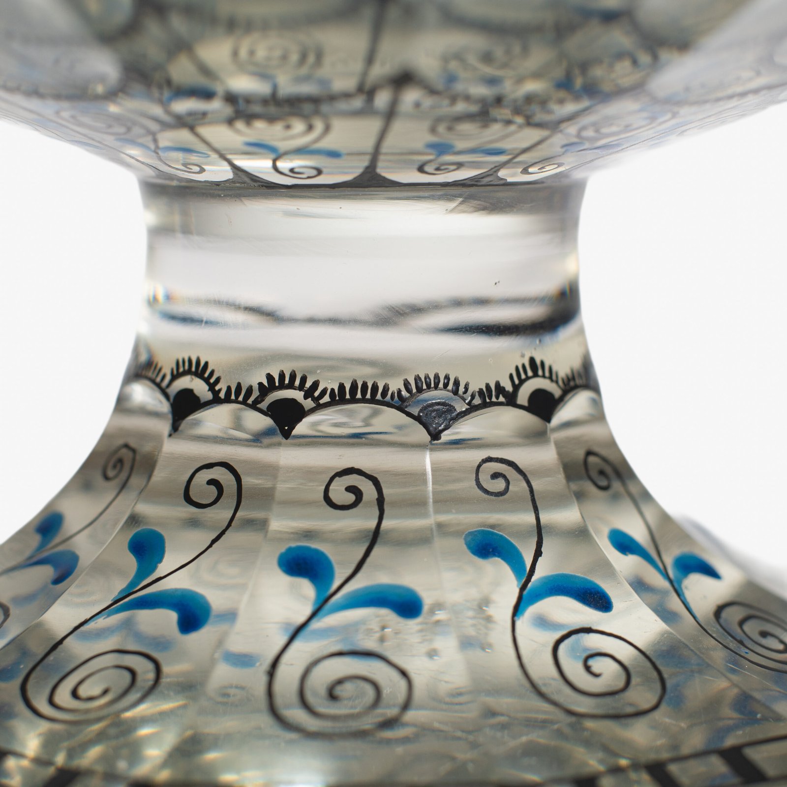 Bohemian Glass Compote, c. 1915, with hand-enamelled birds in scalloped blue panels, geometric glass cutting, gilt rim and a faceted foot decorated with black scrolls and blue leaves.