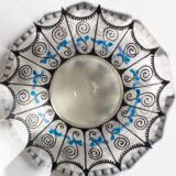 Bohemian Glass Compote, c. 1915, with hand-enamelled birds in scalloped blue panels, geometric glass cutting, gilt rim and a faceted foot decorated with black scrolls and blue leaves.