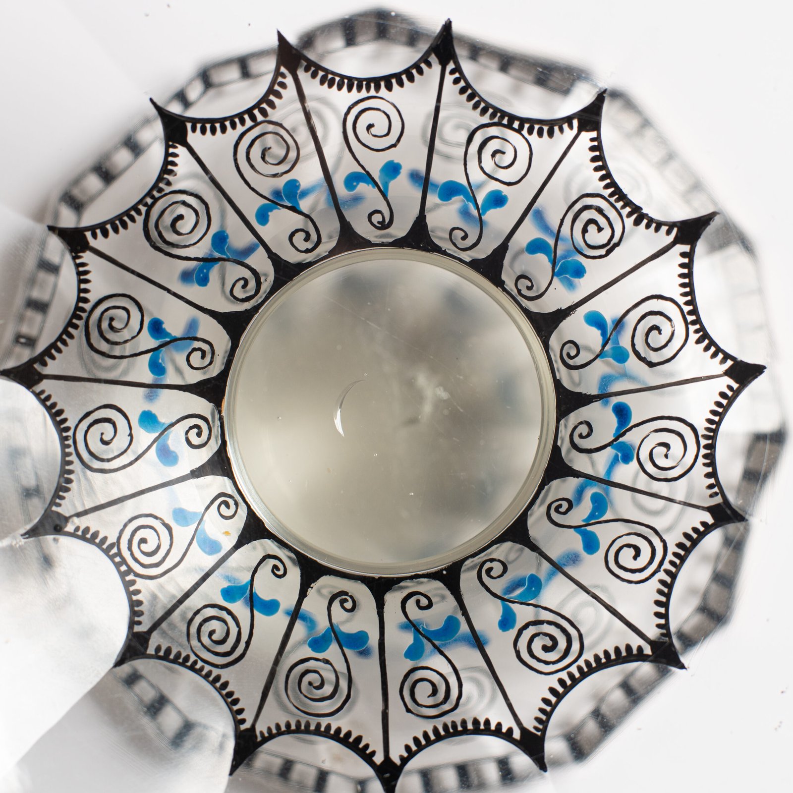 Bohemian Glass Compote, c. 1915, with hand-enamelled birds in scalloped blue panels, geometric glass cutting, gilt rim and a faceted foot decorated with black scrolls and blue leaves.