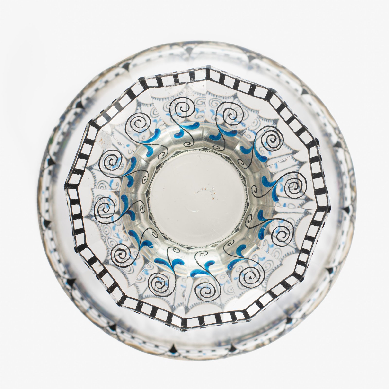 Bohemian Glass Compote, c. 1915, with hand-enamelled birds in scalloped blue panels, geometric glass cutting, gilt rim and a faceted foot decorated with black scrolls and blue leaves.